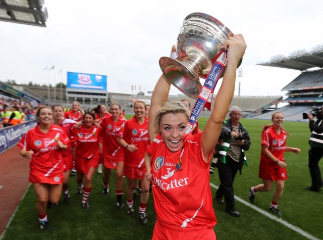 Anna Geary and the Cork players with the O'Duffy cup
