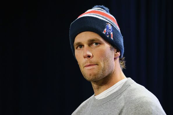 FOXBORO, MA - JANUARY 22: New England Patriots Quarterback Tom Brady talks to the media during a press conference to address the under inflation of footballs used in the AFC championship game at Gillette Stadium on January 22, 2015 in Foxboro, Massachusetts.  (Photo by Maddie Meyer/Getty Images)