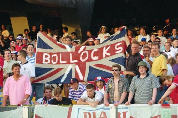 English football supporters display a provocative bollocks slogan to their Union Jack flag during their Group F match against the Republic of Ireland during the 1990 FIFA World Cup on 11 June 1990 at the Sant Elia Stadium in Cagliari, Italy. The match resulted in a 1-1 draw .(Photo by David Cannon/Getty Images)
