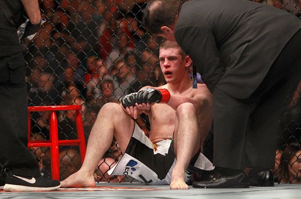 LAS VEGAS, NV - JANUARY 31:  Joe Lauzon rests on the mat after losing a lightweight bout against Al Iaquinta during UFC 183 at the MGM Grand Garden Arena on January 31, 2015 in Las Vegas, Nevada. Iaquinta won with a second-round TKO.  (Photo by Steve Marcus/Getty Images)