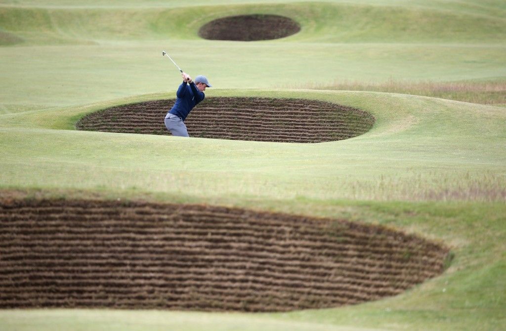 ST ANDREWS, SCOTLAND - JULY 19: Amateur Paul Dunne of Ireland plays out of a bunker on the 5th hole during the third round of the 144th Open Championship at The Old Course on July 19, 2015 in St Andrews, Scotland. (Photo by Streeter Lecka/Getty Images)