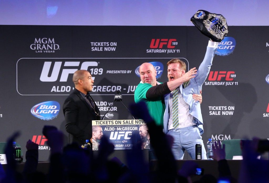 UFC 189 World Championship Tour, The Convention Centre Dublin 31/3/2015 Conor McGregor takes Jose Aldo's belt and UFC's Dana White attempts to intervene Mandatory Credit ©INPHO/Cathal Noonan
