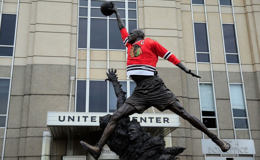 CHICAGO, IL - JUNE 22: A Chicago Blackhawks jersey is seen on the statue of former Chicago Bull and Basketball Hall of Famer Michael Jordan prior to the Blackhawks hosting the Boston Bruins in Game Five of the 2013 NHL Stanley Cup Final at United Center on June 22, 2013 in Chicago, Illinois. (Photo by Jamie Squire/Getty Images)