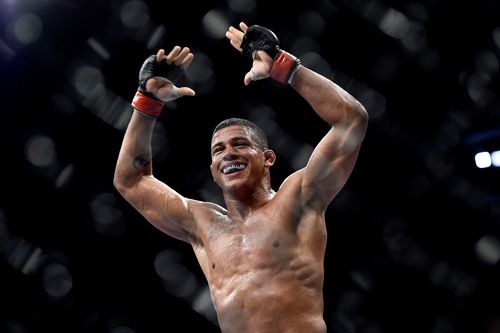 RIO DE JANEIRO, BRAZIL - OCTOBER 25: Gilbert Burns of Brazil celebrates after his submission victory over Christos Giagos in their lightweight bout during the UFC 179 event at Maracanazinho on October 25, 2014 in Rio de Janeiro, Brazil. (Photo by Buda Mendes/Getty Images)