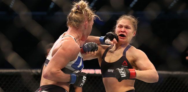 MELBOURNE, AUSTRALIA - NOVEMBER 15:  Ronda Rousey of the United States (R) and Holly Holm of the United States compete in their UFC women's bantamweight championship bout during the UFC 193 event at Etihad Stadium on November 15, 2015 in Melbourne, Australia.  (Photo by Quinn Rooney/Getty Images)
