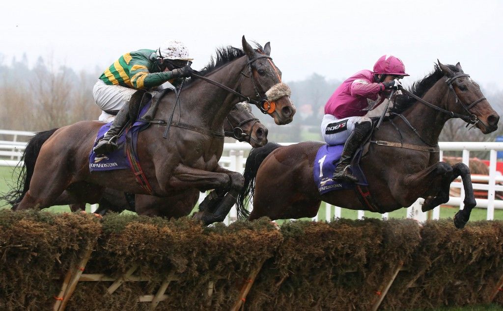 2015 Leopardstown Christmas Festival, Leopardstown Racecourse, Dublin 26/12/2015 The Thorntons Recycling Maiden Hurdle Jockey Patrick Mullins onboard A Toi Phil (right) clears the last hurdle on his way to winning the race ahead of jockey Mark Walsh onboard Don't Touch It (left) Mandatory Credit ©INPHO/©INPHO/Cathal Noonan