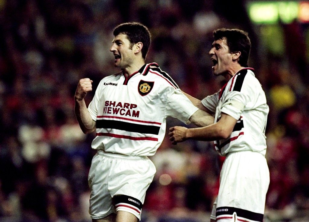 5 May 1999: Denis Irwin of Manchester United celebrates his goal with team mate Roy Keane during the FA Carling Premiership match against Liverpool played at Anfield in Liverpool, England. The game ended in a 2-2 draw. Mandatory Credit: Ross Kinnaird /Allsport