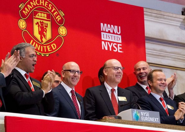NEW YORK, NY - AUGUST 10: In this handout photo provided by the NYSE Euronext, Manchester United Executives Joel Glazer (2nd L) and Avram Glazer (C) and Ed Woodward prepare to ring the Opening Bell at the New York Stock Exchange on August 10, 2012 in New York City. Manchester United shares started trading at USD 14.05 at the opening of the New York Stock Exchange. (Photo Dario Cantatore/Getty Images via NYSE Euronext)