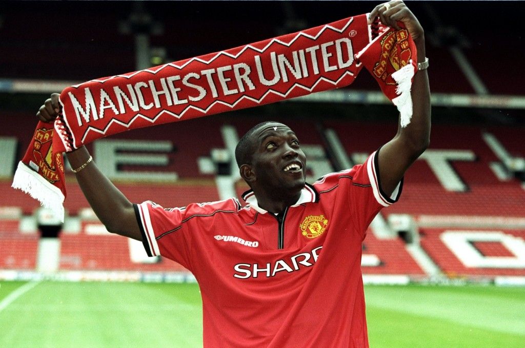 20 Aug 1998:  Dwight Yorke of Trinidad and Tobago completes his 12 million pound transfer to Manchester United at Old Trafford in Manchester, England.  Mandatory Credit: Allsport UK /Allsport