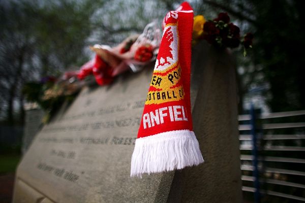 SHEFFIELD, ENGLAND - APRIL 14: Floral tributes and Liverpool scarves lay in tribute on the Hillsborough disaster memorial at Sheffield Wednesday FC on the eve of the 20th anniversary of the Hillsborough disaster on April 14, 2009, Sheffield, England. Sheffield Wednesday FC are not holding an official service to mark the disaster but will be opening the Leppings lane end for people wishing to pay their respects. A total of 96 Liverpool supporters lost their lives during a crush at an FA Cup semi final against Nottingham Forest at the Hillsborough football ground in Sheffield, South Yorkshire on April 15, 1989. (Photo by Christopher Furlong/Getty Images)