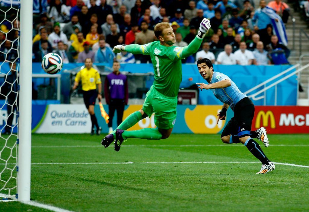 SAO PAULO, BRAZIL - JUNE 19: Luis Suarez of Uruguay scores his team's first goal past Joe Hart of England during the 2014 FIFA World Cup Brazil Group D match between Uruguay and England at Arena de Sao Paulo on June 19, 2014 in Sao Paulo, Brazil. (Photo by Clive Rose/Getty Images)