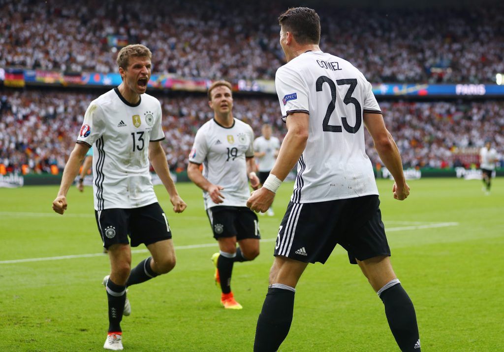 PARIS, FRANCE - JUNE 21: Mario Gomez (R) of Germany celebrates scoring the opening goal with his team mate Thomas Mueller (L) during the UEFA EURO 2016 Group C match between Northern Ireland and Germany at Parc des Princes on June 21, 2016 in Paris, France. (Photo by Clive Mason/Getty Images)