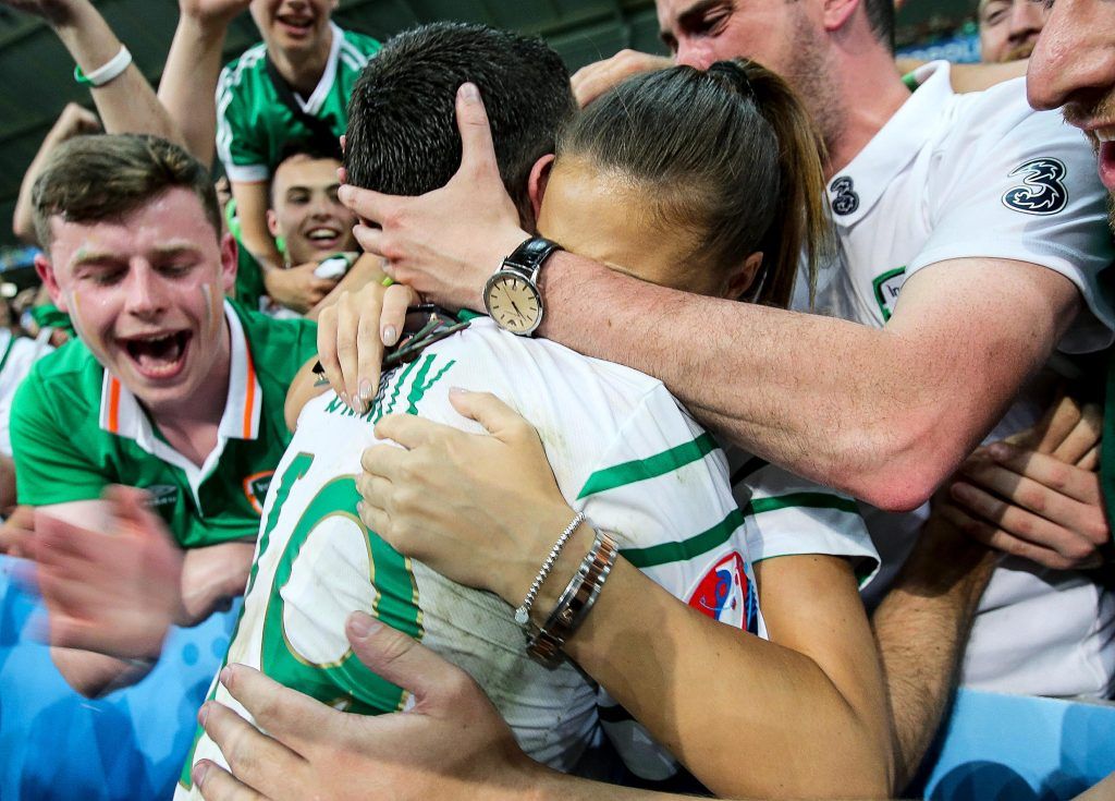 Robbie Brady celebrates with his girlfriend Kerrie Harris and supporters after the game 22/6/2016