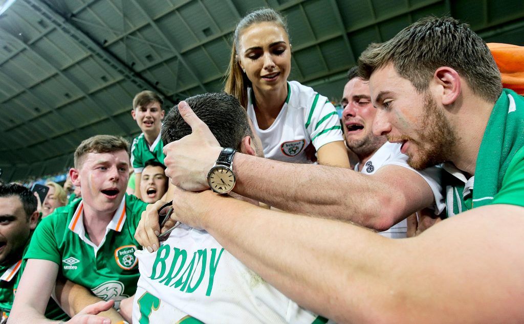 Robbie Brady celebrates with his girlfriend Kerrie Harris and supporters after the game 22/6/2016