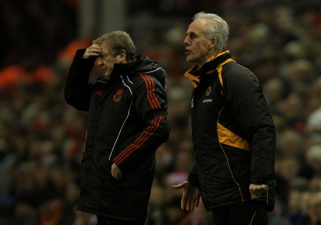 LIVERPOOL, ENGLAND - DECEMBER 29: Wolverhampton Wanderers Manager Mick McCarthy issues instructions as Liverpool Manager Roy Hodgson looks on during the Barclays Premier League match between Liverpool and Wolverhampton Wanderers at Anfield on December 29, 2010 in Liverpool, England. (Photo by Clive Brunskill/Getty Images)