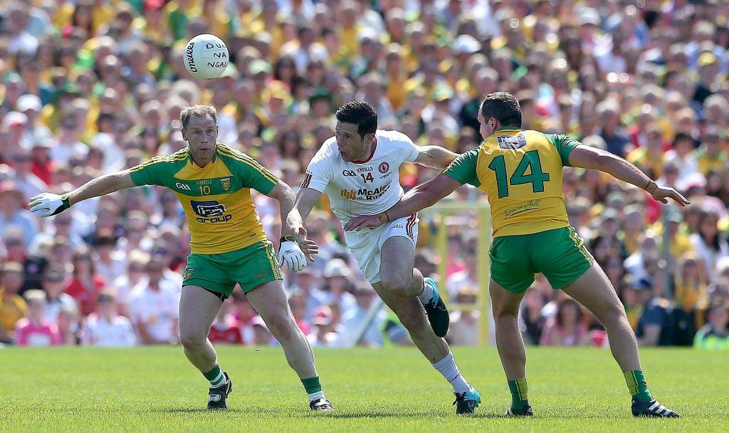 Ulster GAA Senior Football Championship Final, Clones, Monaghan 17/7/2016 Tyrone vs Donegal Tyrone's Sean Cavanagh tackled by Anthony Thompson and Michael Murphy of Donega Mandatory Credit ©INPHO/Lorraine O'Sullivan
