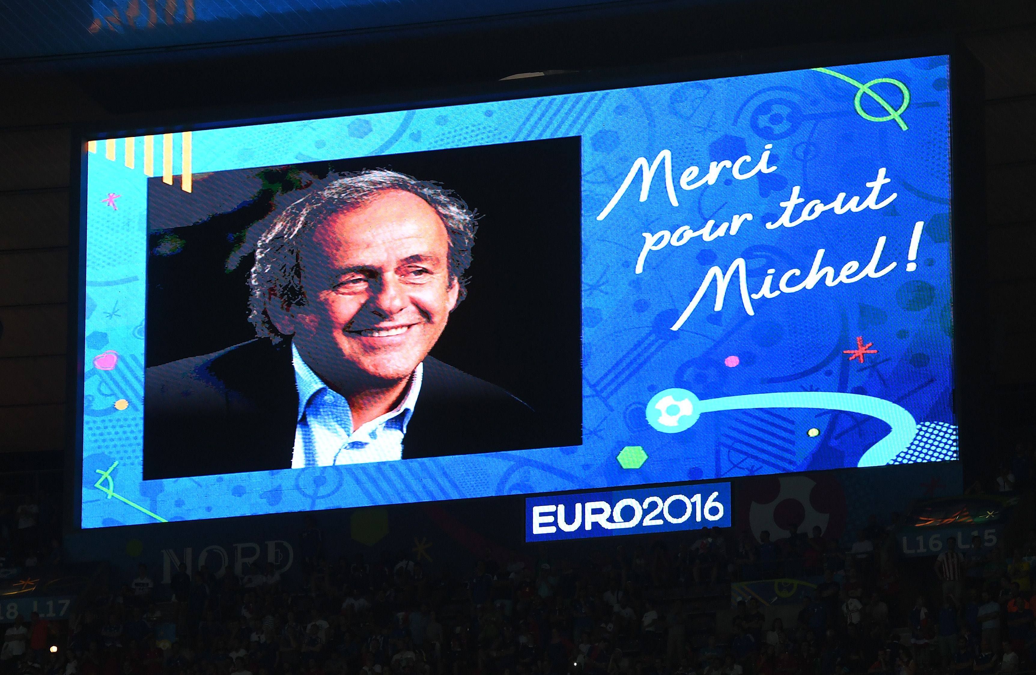 PARIS, FRANCE - JULY 10: A message on the big screen in the stadium from Former french international and Suspended UEFA president Michel Platini is seen during the UEFA EURO 2016 Final match between Portugal and France at Stade de France on July 10, 2016 in Paris, France. (Photo by Michael Regan/Getty Images)