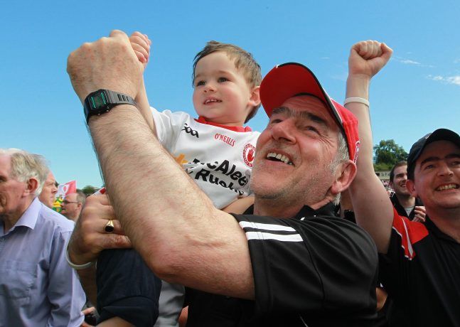 Mickey Harte celebrates with his grandson Michael at the final whistle 17/7/2016