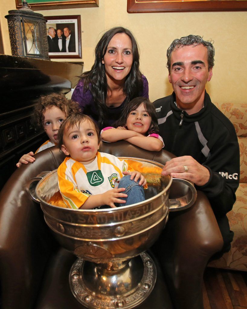 GAA Football All Ireland Champions Donegal at Team Hotel 24/9/2012 Manager Jim McGuinness with his family, wife Yvonne, and kids Toni-Marie, Michael Anthony and Jim Jr in the Sam Maguire cup Mandatory Credit ©INPHO/Cathal Noonan