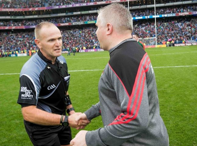 Stephen Rochford shakes hands with referee Conor Lane after the drawn game 18/9/2016