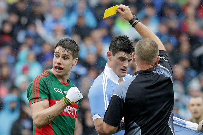Dublin's Diarmuid Connolly and Lee Keegan of Mayo receive yellow cards 18/9/2016