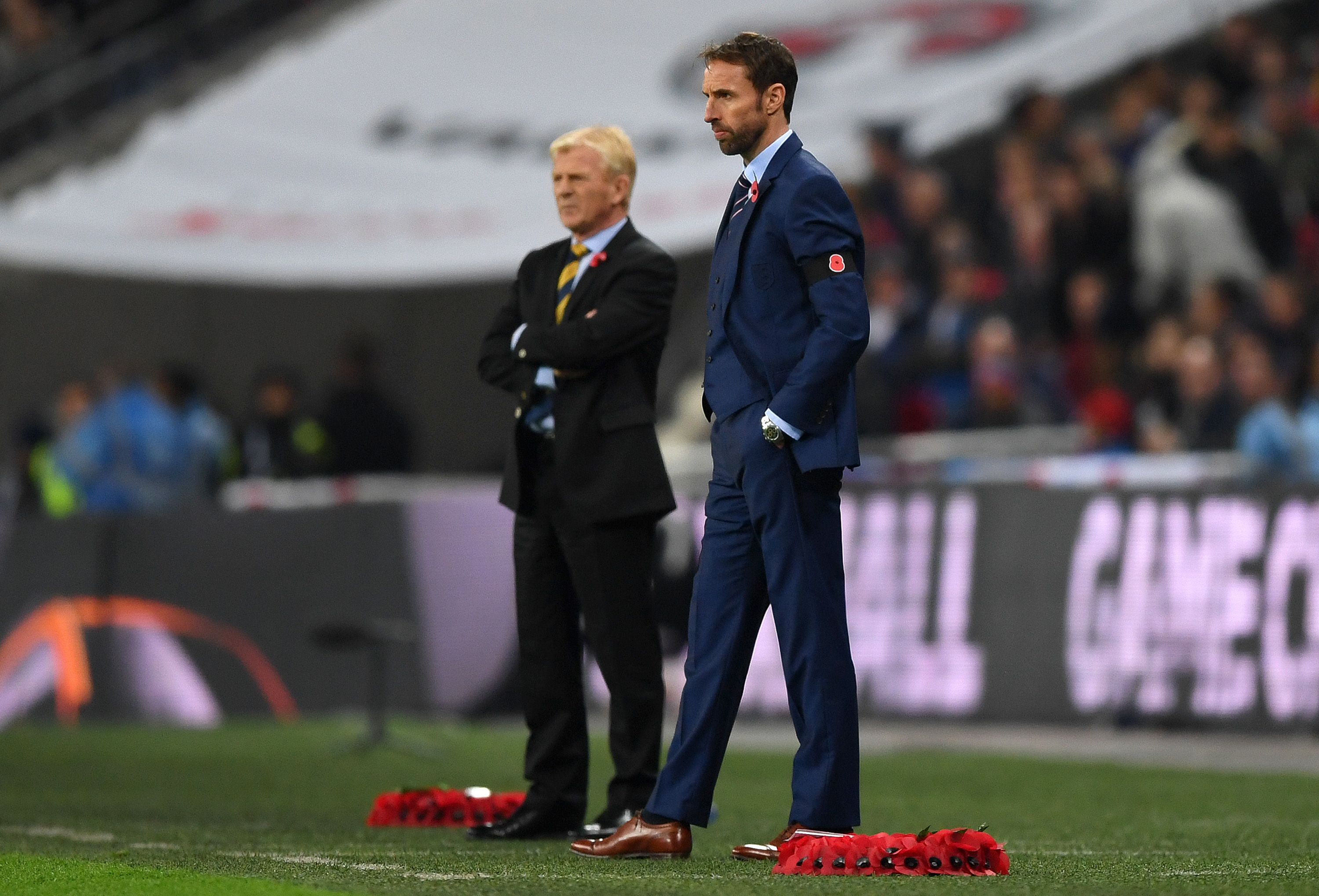LONDON, ENGLAND - NOVEMBER 11: Gareth Southgate interim manager of England wears a Poppy black armband as he looks on alongside Gordon Strachan of Scotland during the FIFA 2018 World Cup qualifying match between England and Scotland at Wembley Stadium on November 11, 2016 in London, England. (Photo by Shaun Botterill/Getty Images)