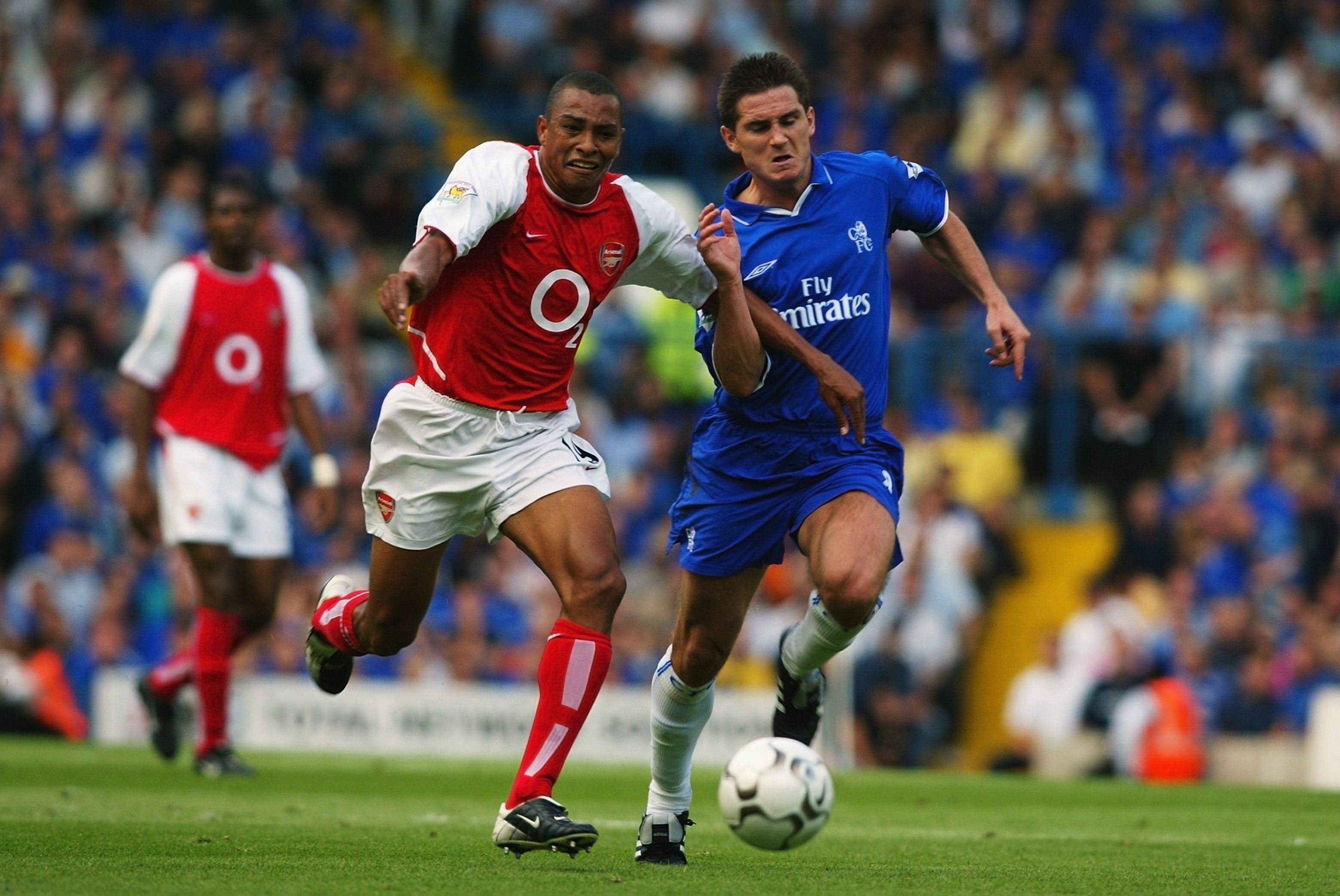 LONDON - SEPTEMBER 1: Frank Lampard of Chelsea tackles Gilberto of Arsenal during the FA Barclaycard Premiership match between Chelsea and Arsenal at Stamford Bridge, London, England on September 1, 2002. (Photo by Ben Radford/Getty Images) The match ended in a 1-1 draw.